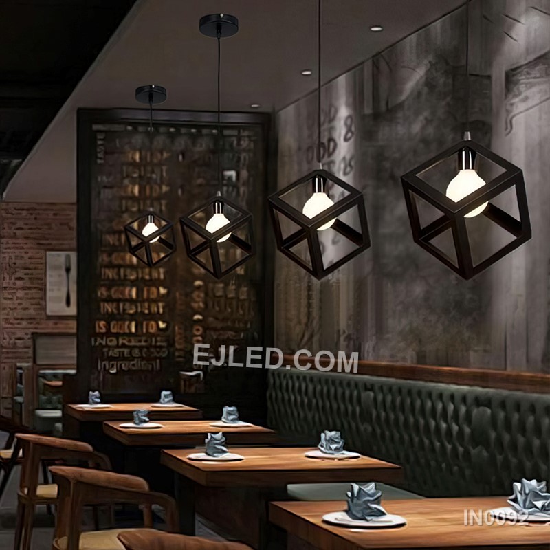 This single pendant light features an open cuboid shade crafted from light-coloured wooden slats, enclosing an inner clear glass cylinder. It offers diffused light and a natural aesthetic. - view 5