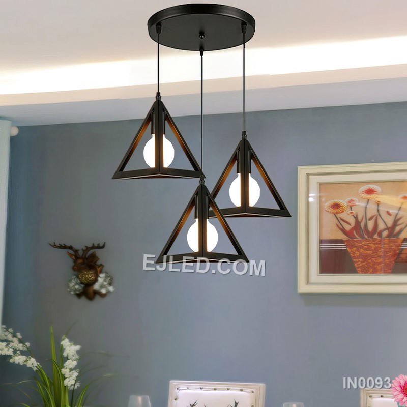 This single pendant light features a striking pyramid-shaped shade, crafted from black-finished metal with opaque sides that direct light downwards. It provides focused illumination for task areas. - view 3
