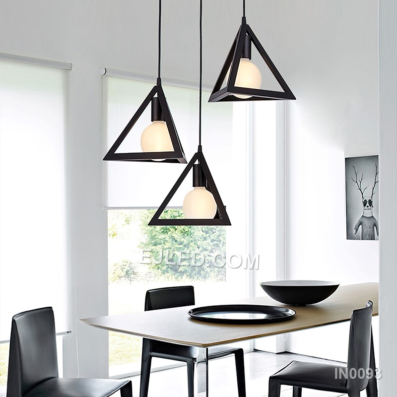This single pendant light features a striking pyramid-shaped shade, crafted from black-finished metal with opaque sides that direct light downwards. It provides focused illumination for task areas. - view 4