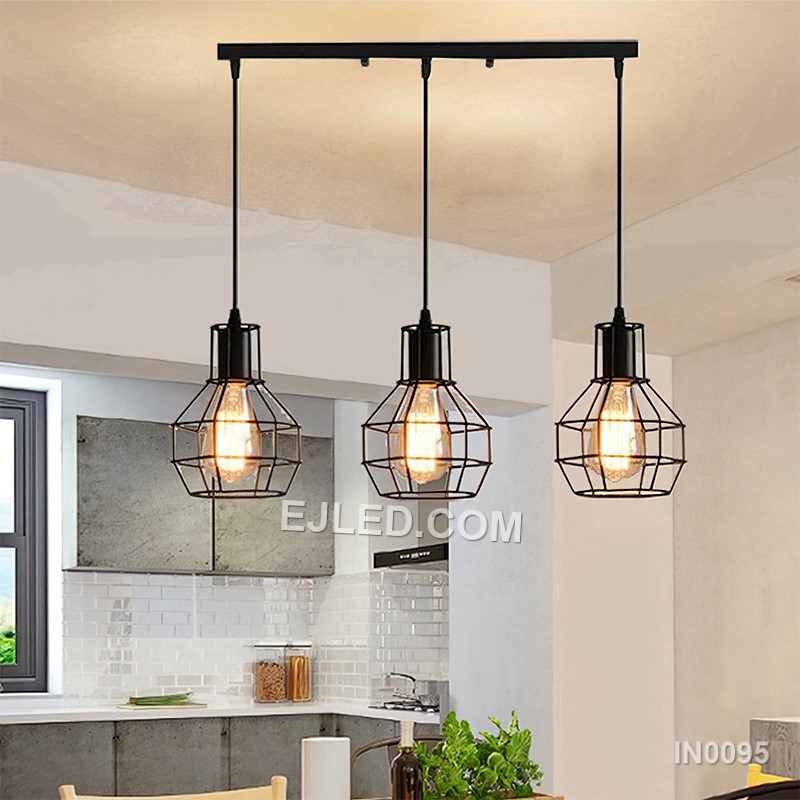 Statement lighting for dining areas or hotel lobbies, the IN0095 pendant light brings a unique blend of materials. An open square cage of black metal encloses an inner wooden frame, creating a rustic-industrial aesthetic with a single lamp inside. - view 3