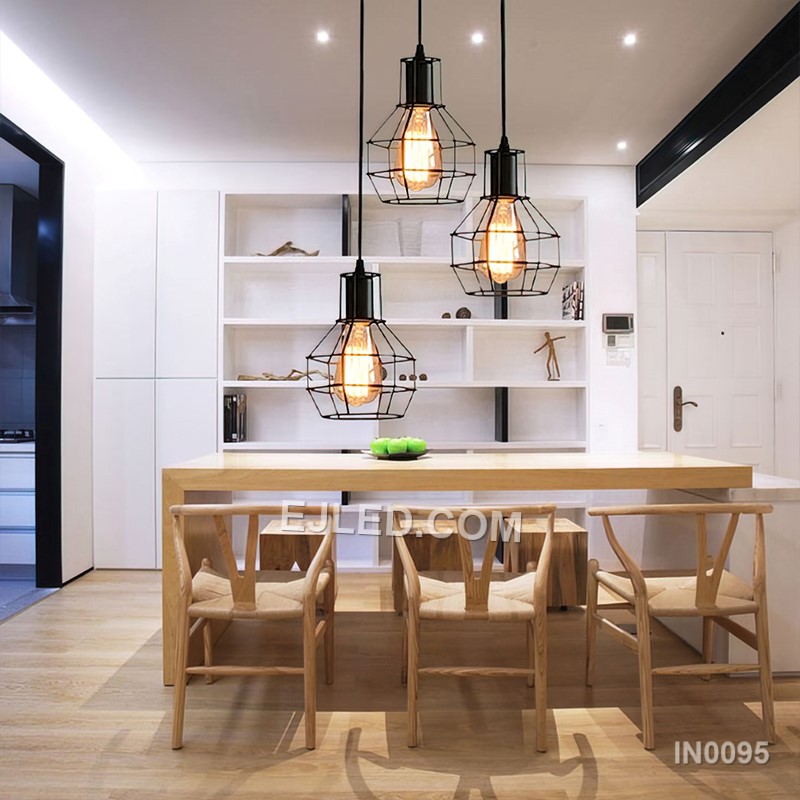Statement lighting for dining areas or hotel lobbies, the IN0095 pendant light brings a unique blend of materials. An open square cage of black metal encloses an inner wooden frame, creating a rustic-industrial aesthetic with a single lamp inside. - view 5