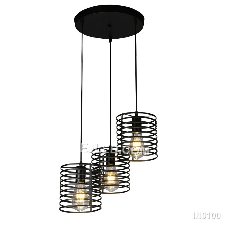 Unlike single-lamp designs, the IN0100 pendant light presents a cluster of three cylindrical black iron wire cages, each enclosing a bulb. This arrangement offers broader light coverage and a more substantial visual presence.