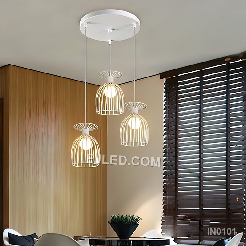 Black iron wire forms three open drum-shaped cages, each housing a single lamp. This multi-lamp pendant hangs from a round canopy, with cords of varying lengths creating a tiered, cluster arrangement. - view 2