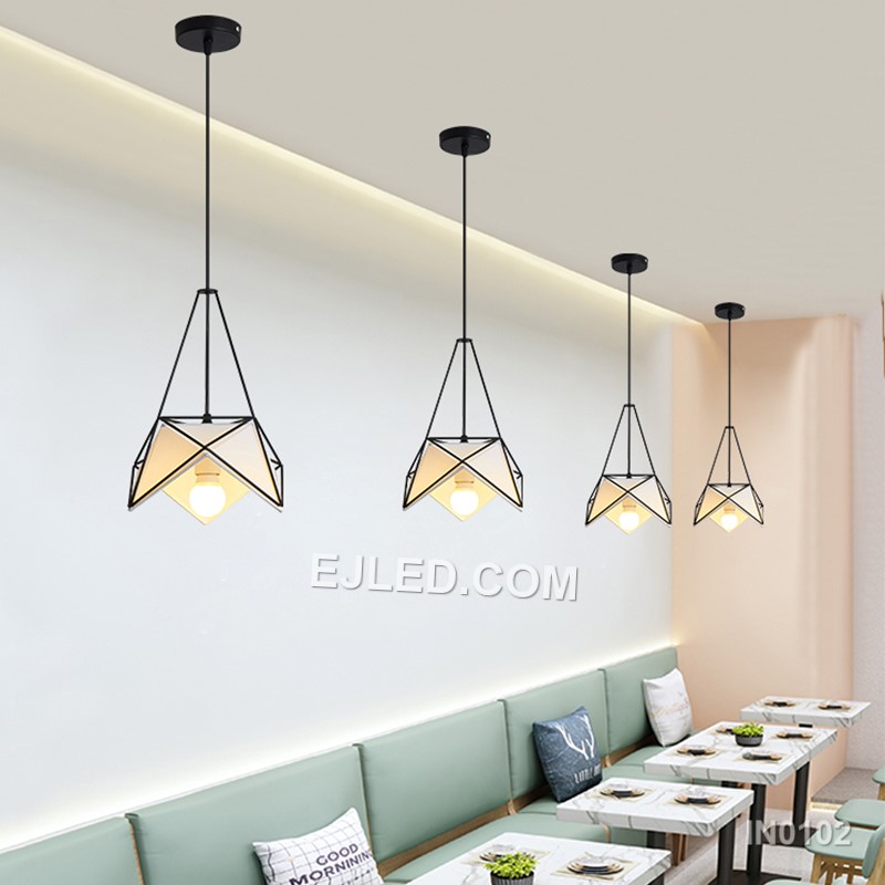 Model IN0102 offers three bell-shaped steel pendant lights, each with an open bottom for directed illumination. Finished in matte black, they suspend from a single rectangular canopy, creating a cohesive lighting solution for linear spaces. - view 2