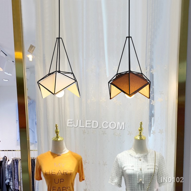 Model IN0102 offers three bell-shaped steel pendant lights, each with an open bottom for directed illumination. Finished in matte black, they suspend from a single rectangular canopy, creating a cohesive lighting solution for linear spaces. - view 4