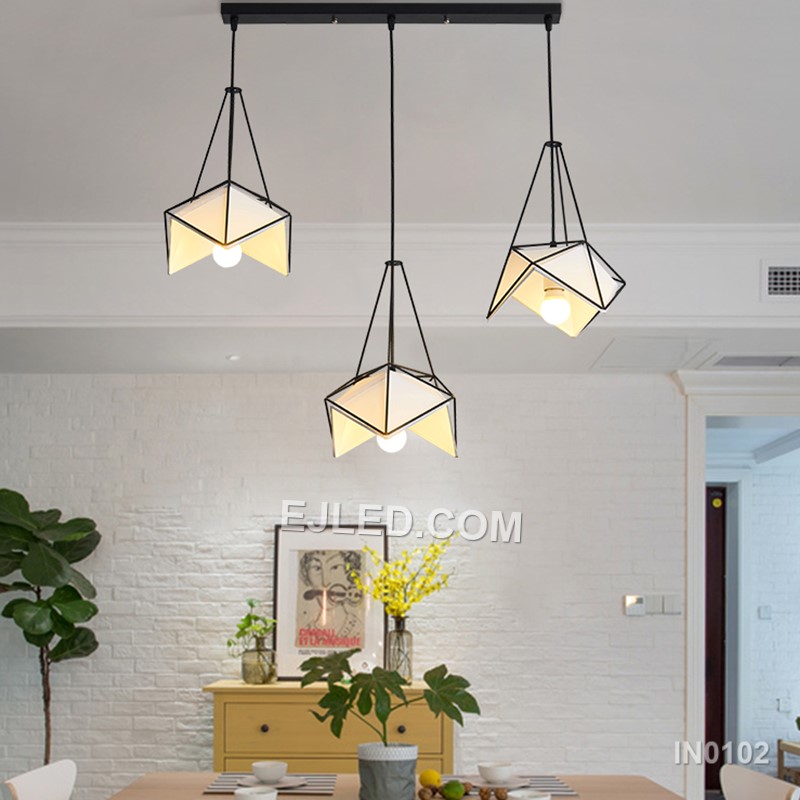 Model IN0102 offers three bell-shaped steel pendant lights, each with an open bottom for directed illumination. Finished in matte black, they suspend from a single rectangular canopy, creating a cohesive lighting solution for linear spaces. - view 5