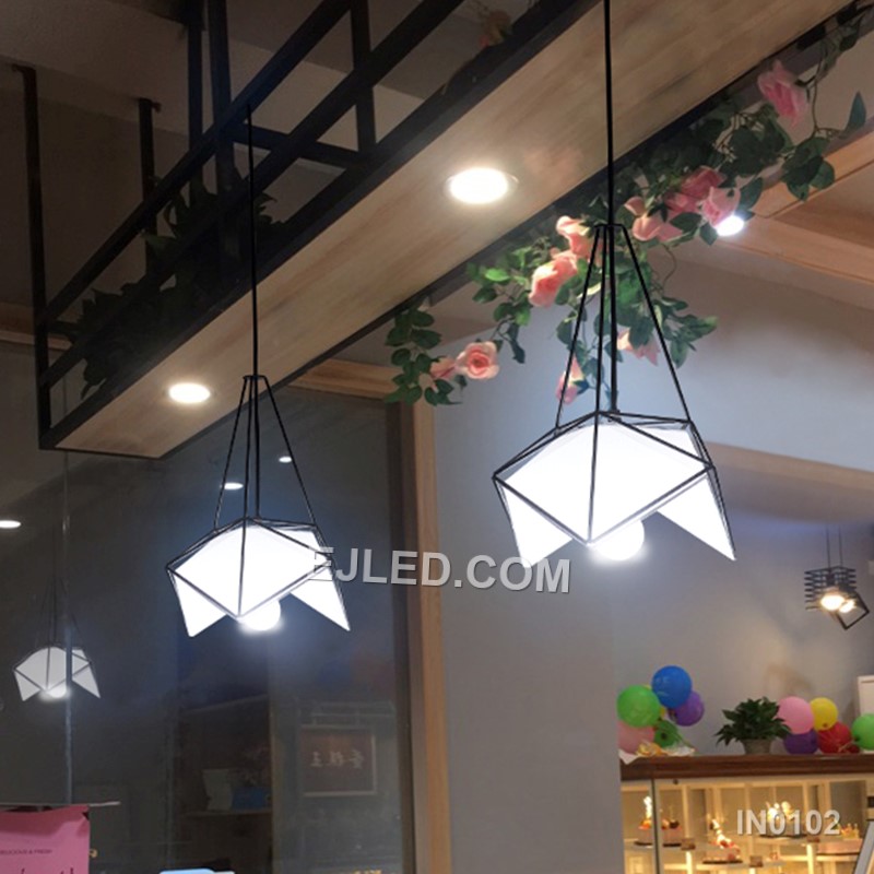 Model IN0102 offers three bell-shaped steel pendant lights, each with an open bottom for directed illumination. Finished in matte black, they suspend from a single rectangular canopy, creating a cohesive lighting solution for linear spaces. - view 6