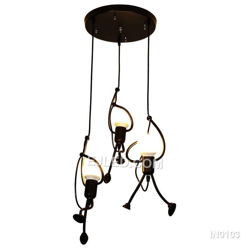 Suitable for adding character to stairwells, children's rooms, or creative hospitality settings, this fixture features three small, round black iron pendants. Playful human-like figures are integrated along each suspension cable, adding unique visual interest.
