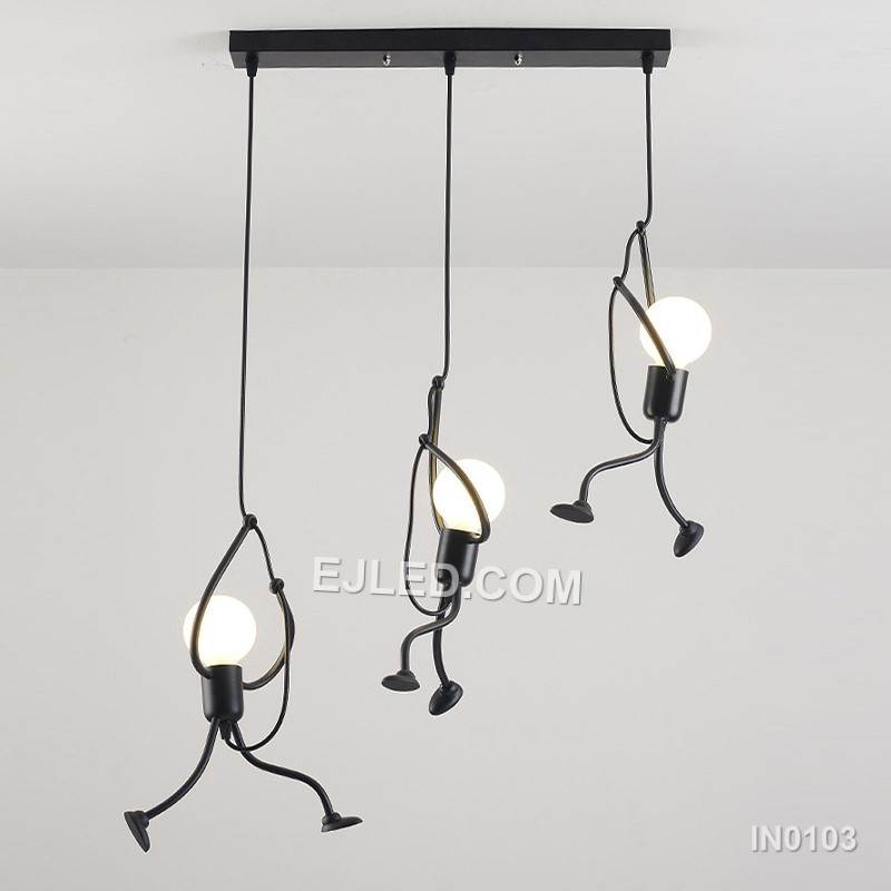 Suitable for adding character to stairwells, children's rooms, or creative hospitality settings, this fixture features three small, round black iron pendants. Playful human-like figures are integrated along each suspension cable, adding unique visual interest. - view 2
