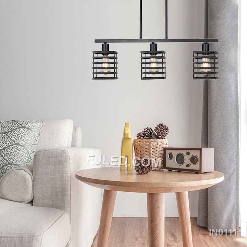 Over kitchen islands, dining tables, or in reception areas, the IN0111 pendant light provides focused illumination from three individual rectangular wire cages. Each black iron cage is open, allowing light to spread from the exposed bulbs within. - view 3
