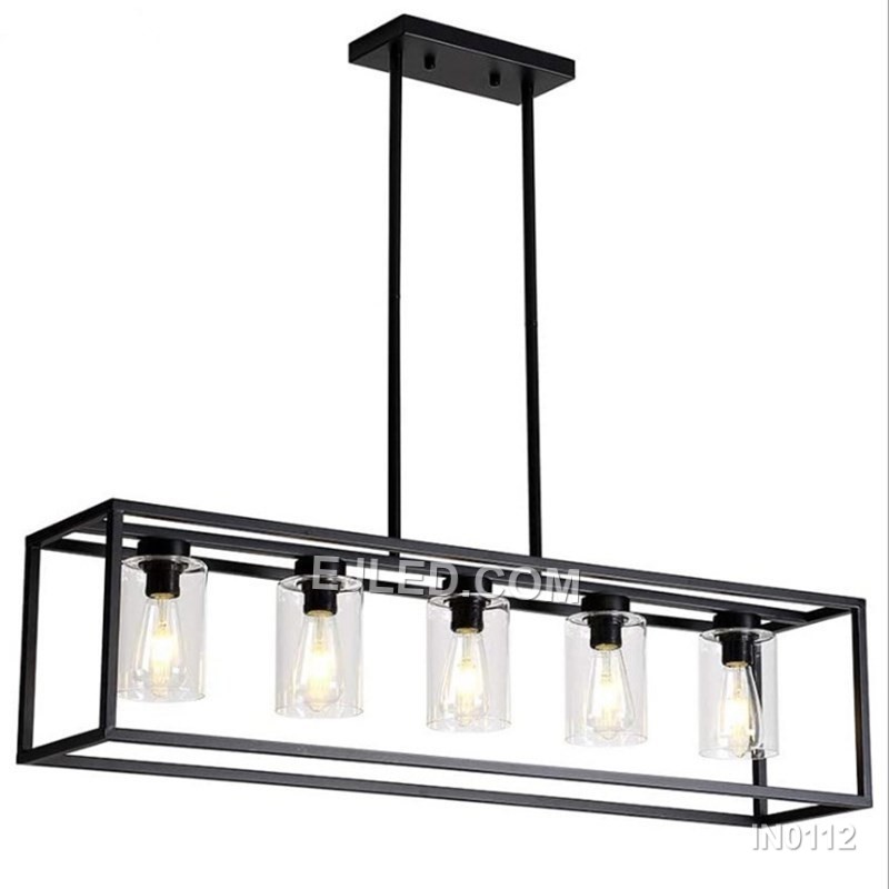 The IN0112 linear pendant light features a black steel frame enclosing five clear glass shades. Suspended by two cables, this fixture offers bright, focused illumination ideal for kitchen islands and long counters.
