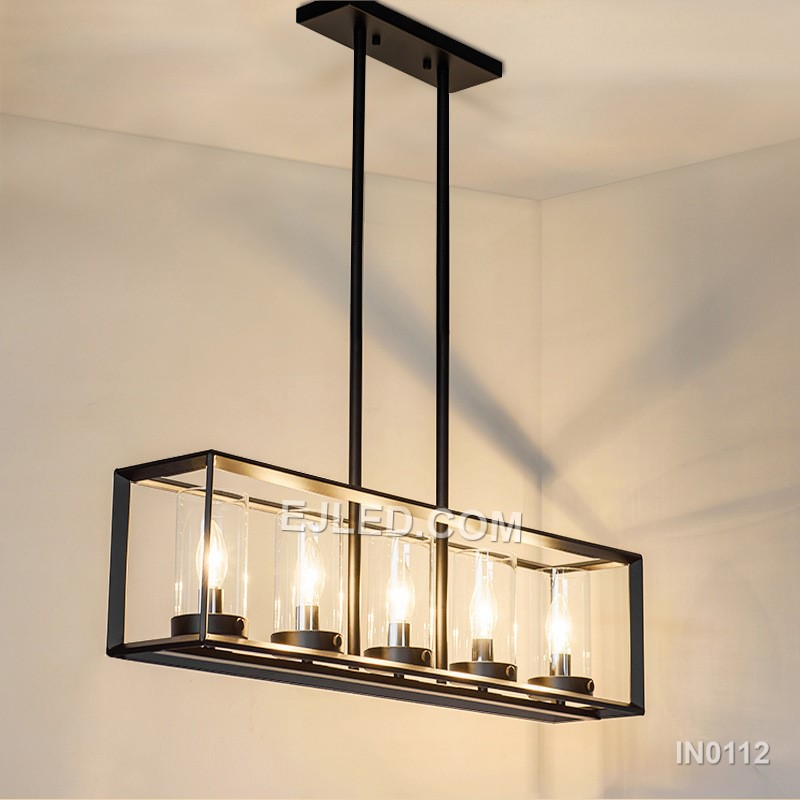 The IN0112 linear pendant light features a black steel frame enclosing five clear glass shades. Suspended by two cables, this fixture offers bright, focused illumination ideal for kitchen islands and long counters. - view 5
