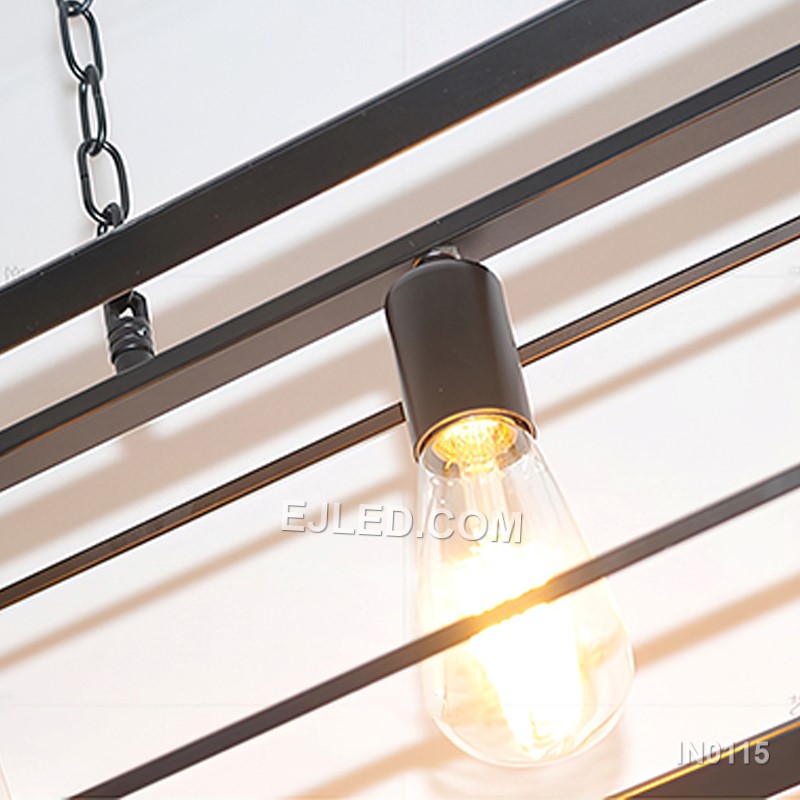 Black iron forms the open rectangular frame of this six-light pendant fixture, suspended by two adjustable chains. Its expansive shape makes it suitable for illuminating large dining tables or expansive kitchen islands. - view 5