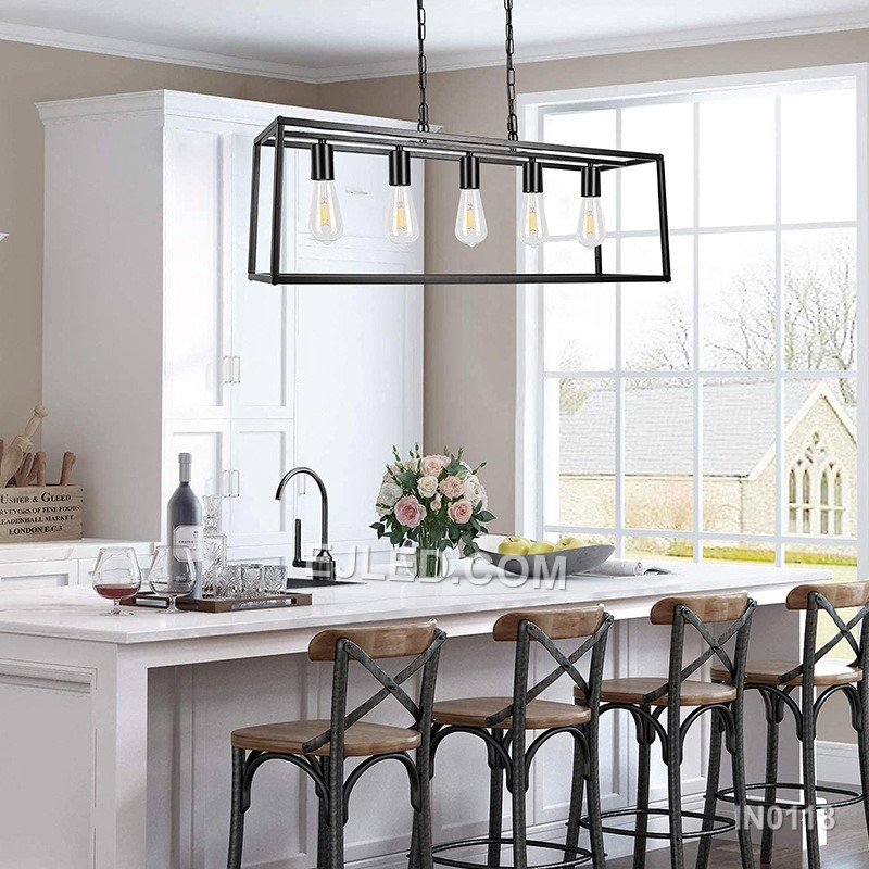 Fabricated from black steel, this pendant light features a lengthy rectangular open cage. It houses five exposed lamps in a linear arrangement, providing extensive, unobstructed illumination suitable for expansive surfaces like kitchen islands. - view 2