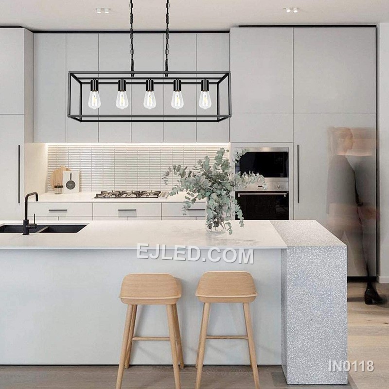 Fabricated from black steel, this pendant light features a lengthy rectangular open cage. It houses five exposed lamps in a linear arrangement, providing extensive, unobstructed illumination suitable for expansive surfaces like kitchen islands. - view 3