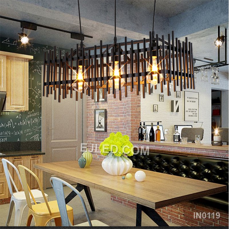 This iron pendant light features a compact rectangular black cage, enclosing three lamps for direct, focused illumination. Its open grid design prevents glare while highlighting the bulbs. - view 2