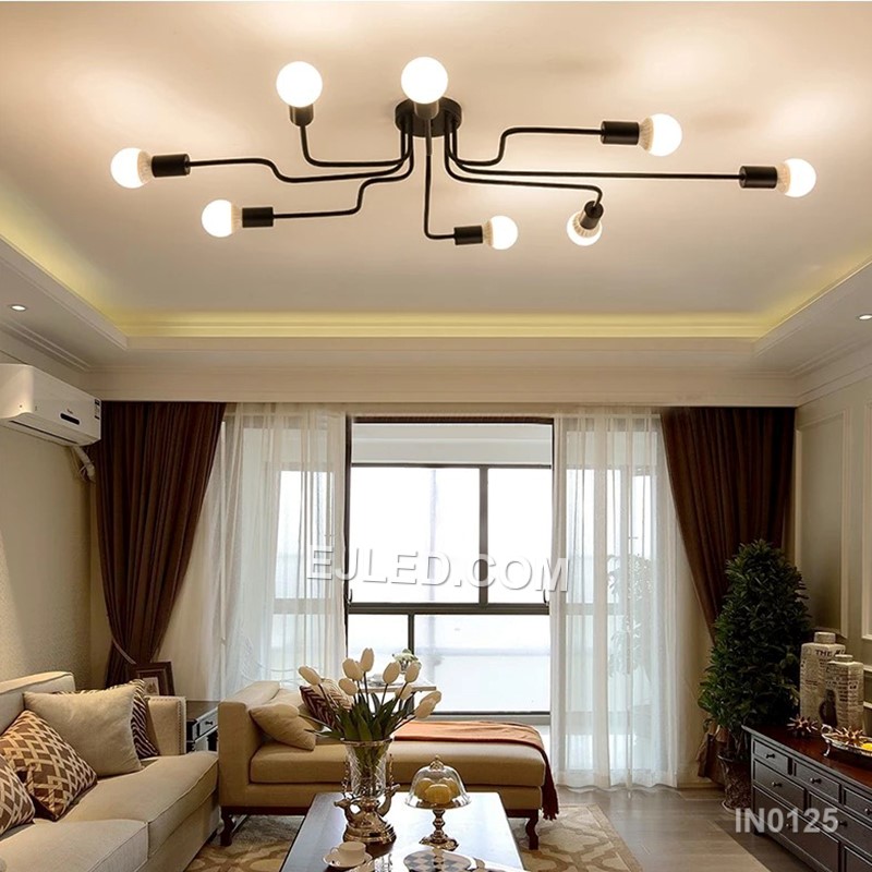 Finished in matte black steel, this close-to-ceiling sputnik fixture offers eight exposed lamp holders on radiating arms. Gold-toned accents at each socket provide visual contrast, making it suitable for spaces needing broad, unshaded illumination without a long drop. - view 2