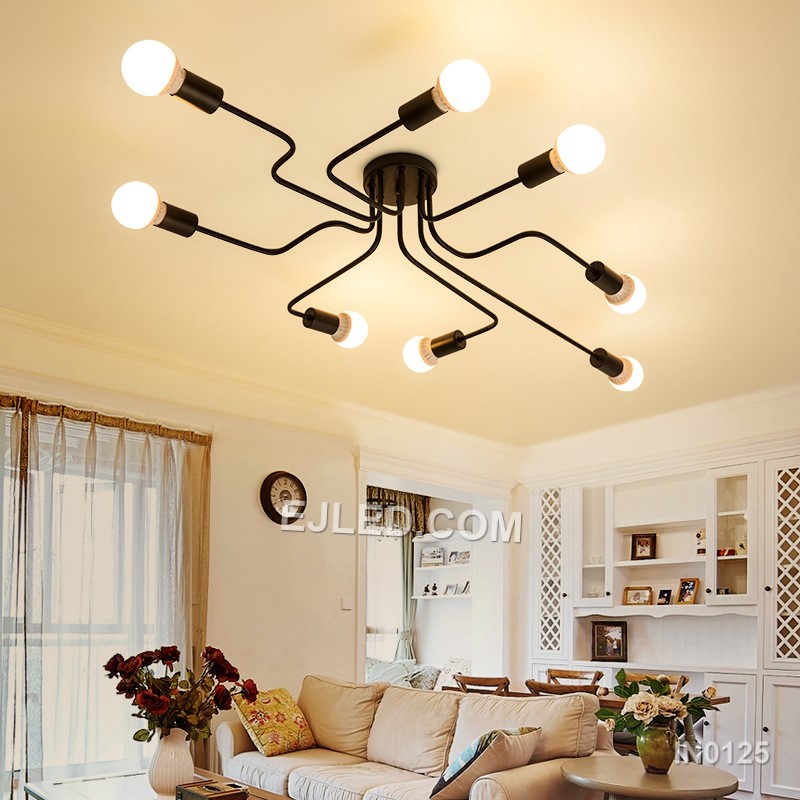 Finished in matte black steel, this close-to-ceiling sputnik fixture offers eight exposed lamp holders on radiating arms. Gold-toned accents at each socket provide visual contrast, making it suitable for spaces needing broad, unshaded illumination without a long drop. - view 3