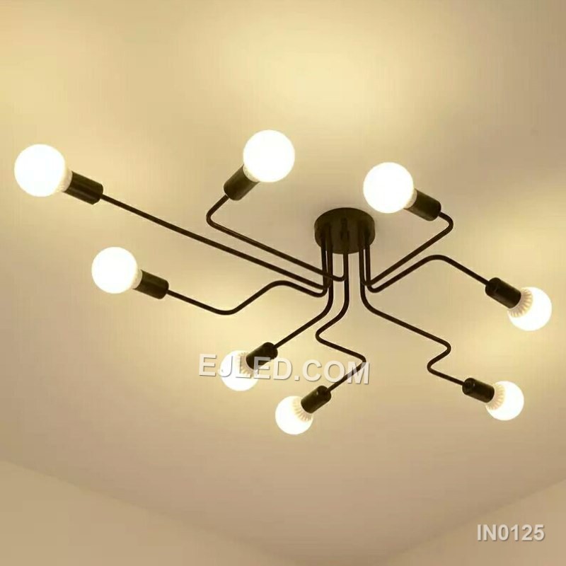 Finished in matte black steel, this close-to-ceiling sputnik fixture offers eight exposed lamp holders on radiating arms. Gold-toned accents at each socket provide visual contrast, making it suitable for spaces needing broad, unshaded illumination without a long drop. - view 4