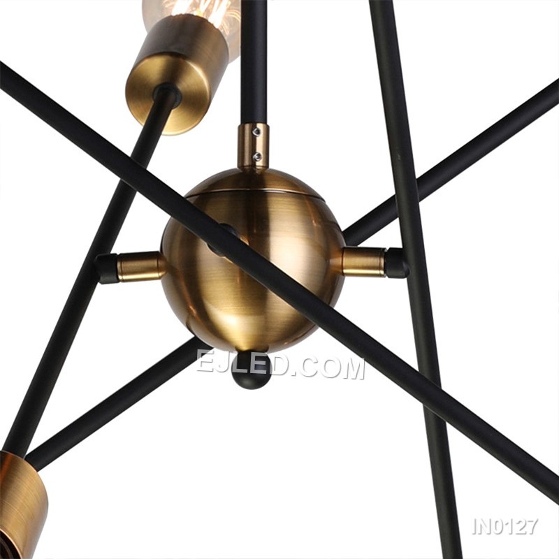 Featuring a brass construction, this 8-lamp sputnik pendant light radiates arms from a central sphere. Black-toned collars at each lamp holder and a matching ceiling rose provide contrast. Suspended by a rigid rod, it offers an unshaded, multi-directional light source. - view 3