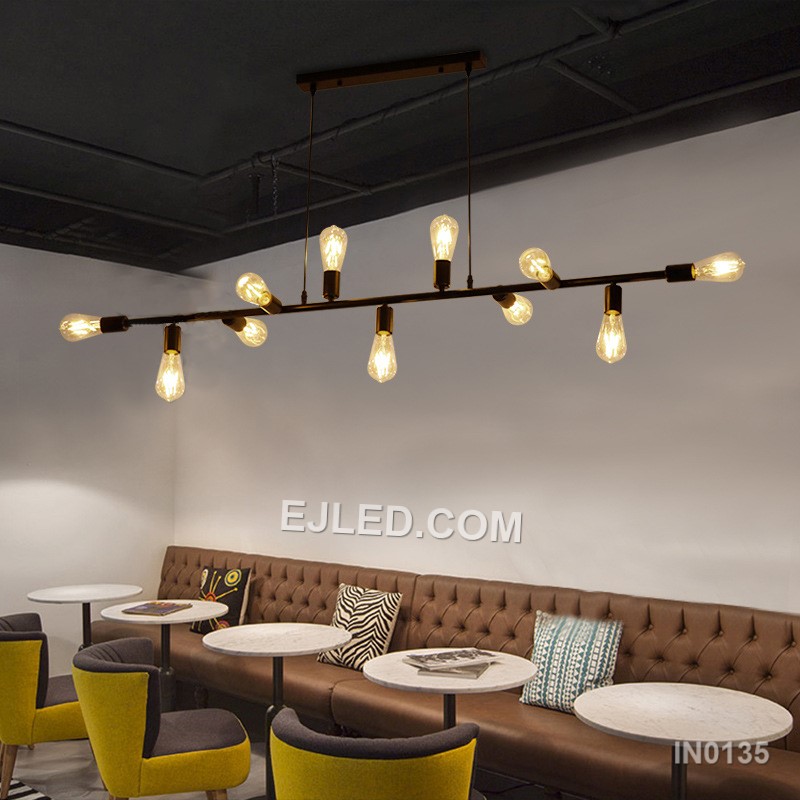 Steel construction defines the IN0135, a large rectangular open-frame pendant light. Eleven lamps radiate from two internal axes, providing extensive, multi-directional illumination. Its matte black finish creates a consistent, contemporary aesthetic. - view 3
