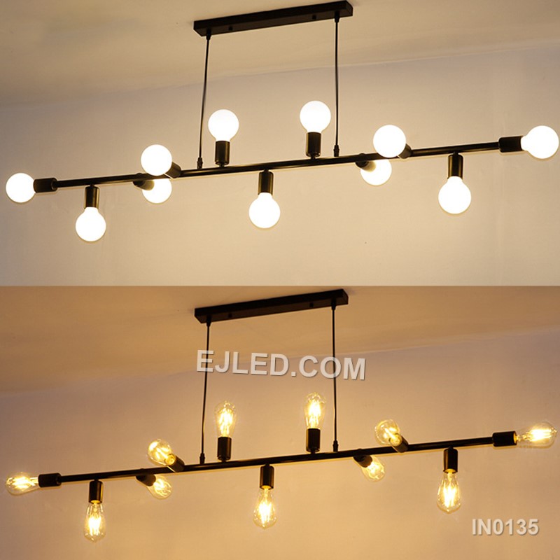Steel construction defines the IN0135, a large rectangular open-frame pendant light. Eleven lamps radiate from two internal axes, providing extensive, multi-directional illumination. Its matte black finish creates a consistent, contemporary aesthetic. - view 4