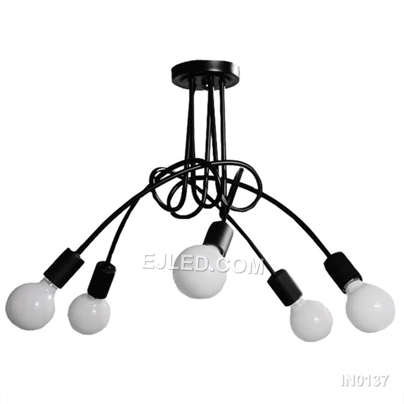 In contemporary dining areas or entryways, the IN0137 pendant presents five opaque white glass globes. These are mounted on brass arms radiating from a central white downrod, creating a balanced, multi-directional light source.