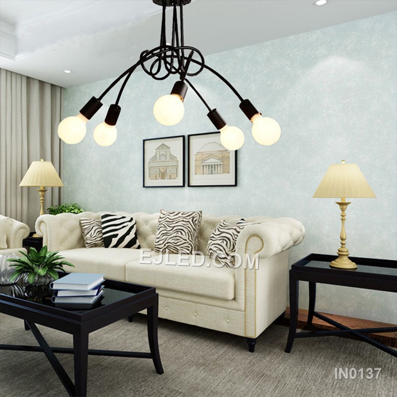In contemporary dining areas or entryways, the IN0137 pendant presents five opaque white glass globes. These are mounted on brass arms radiating from a central white downrod, creating a balanced, multi-directional light source. - view 4