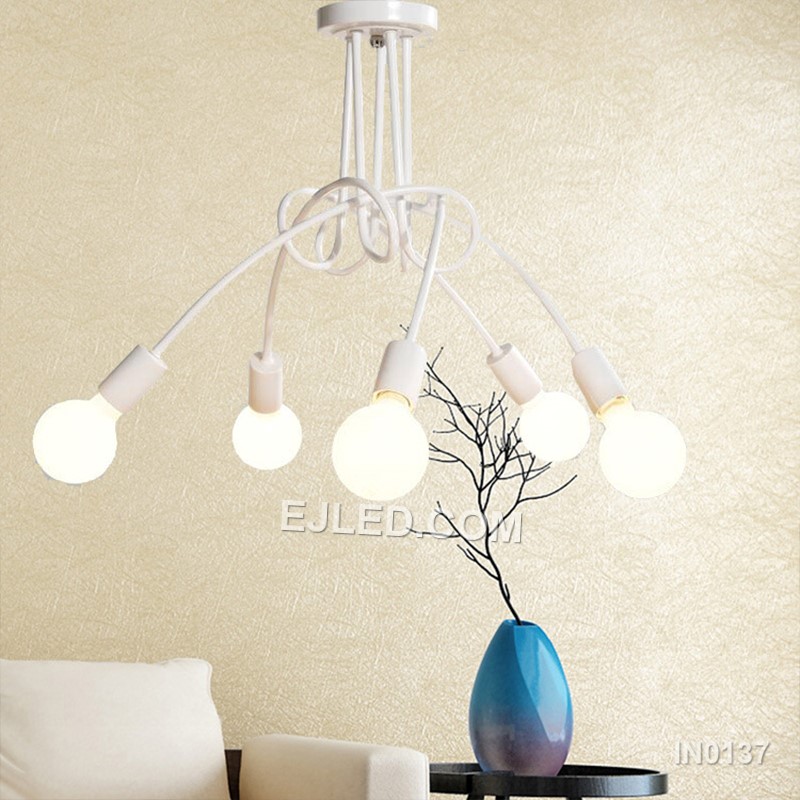 In contemporary dining areas or entryways, the IN0137 pendant presents five opaque white glass globes. These are mounted on brass arms radiating from a central white downrod, creating a balanced, multi-directional light source. - view 5