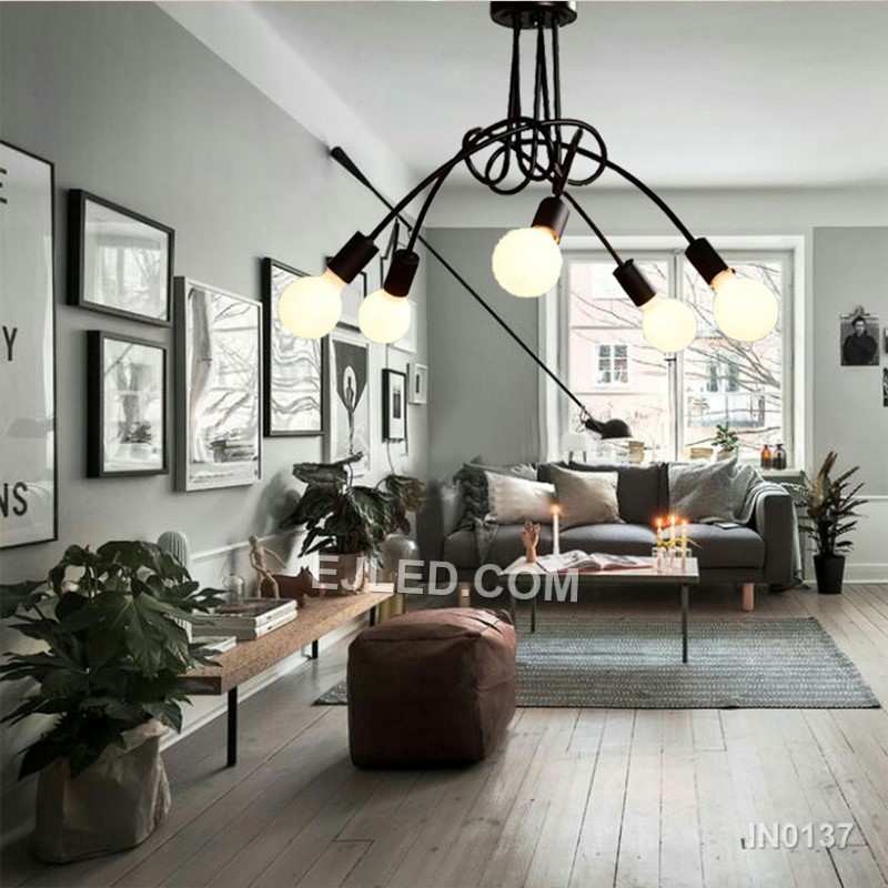 In contemporary dining areas or entryways, the IN0137 pendant presents five opaque white glass globes. These are mounted on brass arms radiating from a central white downrod, creating a balanced, multi-directional light source. - view 6