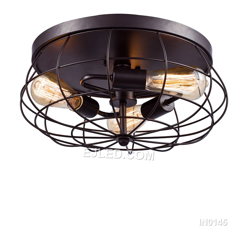 Iron craftsmanship shapes the IN0145, a semi-flush pendant light with a round, open-cage drum shade in matte black. Five exposed lamps within the frame allow for decorative bulb choices, creating a warm, ambient light that casts subtle patterns. - view 2