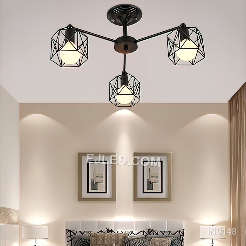 Three iron pendants form the clustered IN0148 fixture, each featuring an open conical wire cage in a black finish. Suspended at varying heights, they offer broad illumination and a distinct silhouette suitable for focused task lighting or ambient glow. - view 3