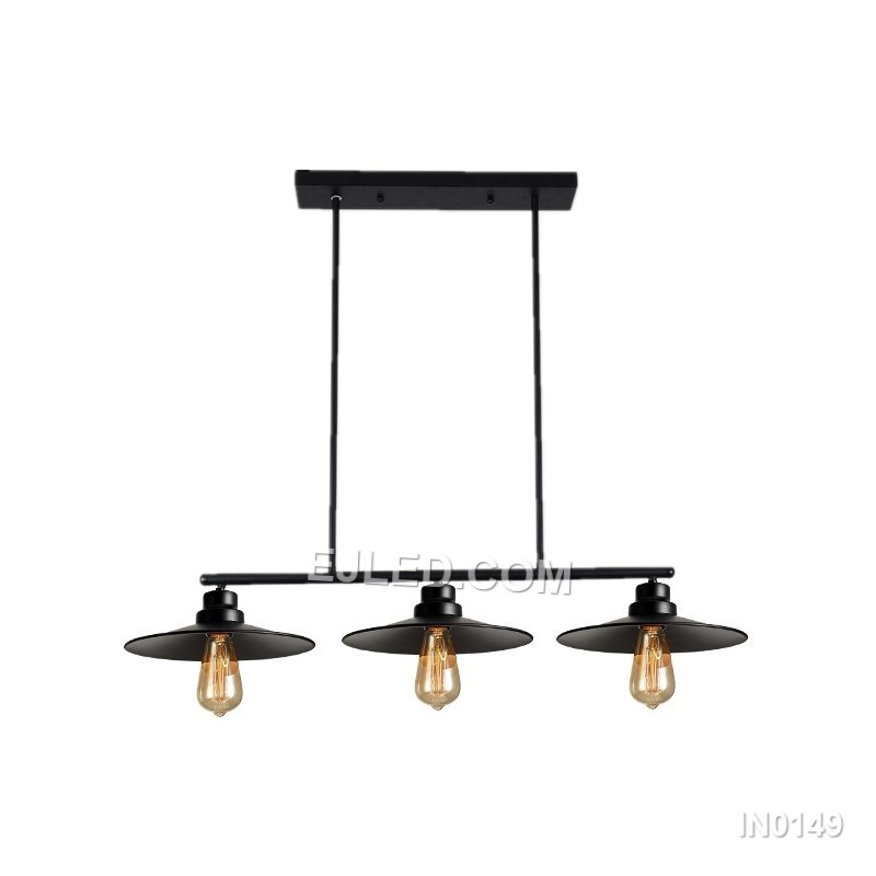 A linear steel pendant, the IN0149 features three individual barrel-shaped shades crafted from black perforated metal. Mounted along a horizontal bar, these unique enclosures diffuse light while casting subtle patterns, distinguishing it from open-cage designs.