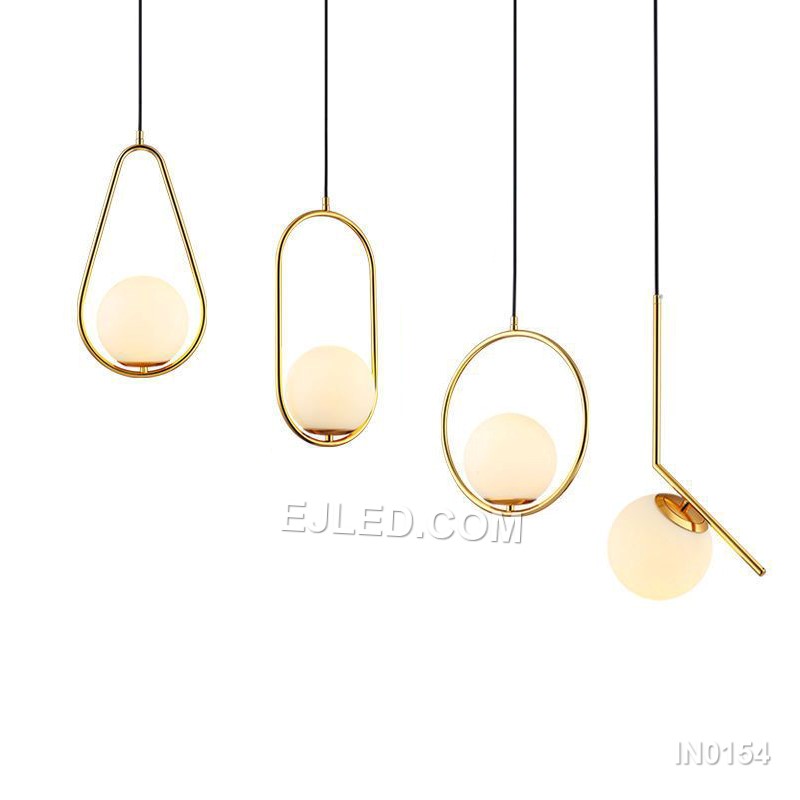 Brass and glass combine in the IN0154, a single pendant light with an open-bottom round glass shade encased by a polished brass frame. This design offers a broad, unobstructed downward light while its open frame minimises glare from the bulb.