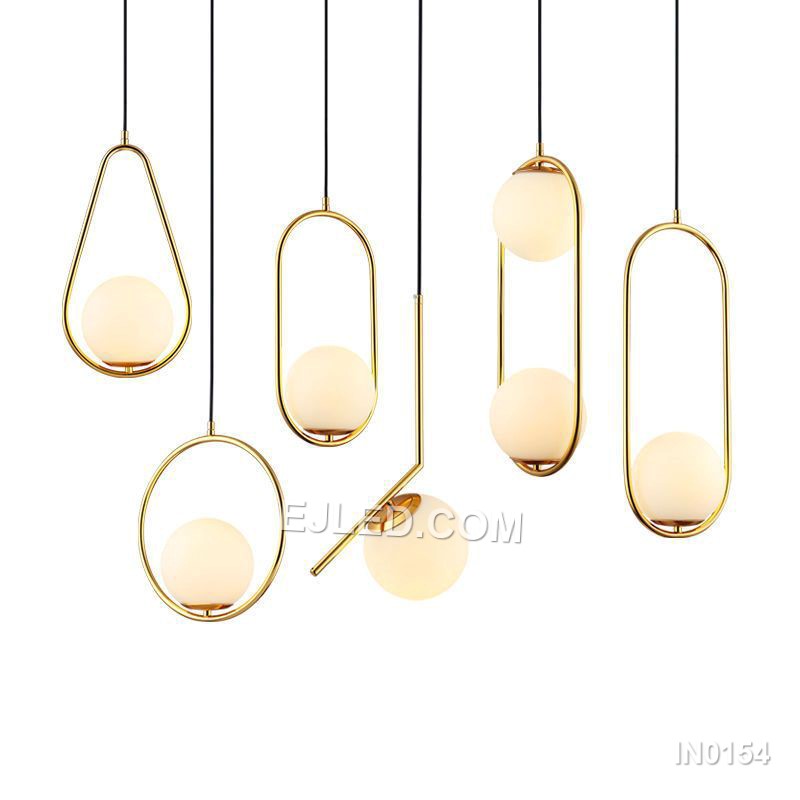 Brass and glass combine in the IN0154, a single pendant light with an open-bottom round glass shade encased by a polished brass frame. This design offers a broad, unobstructed downward light while its open frame minimises glare from the bulb. - view 2