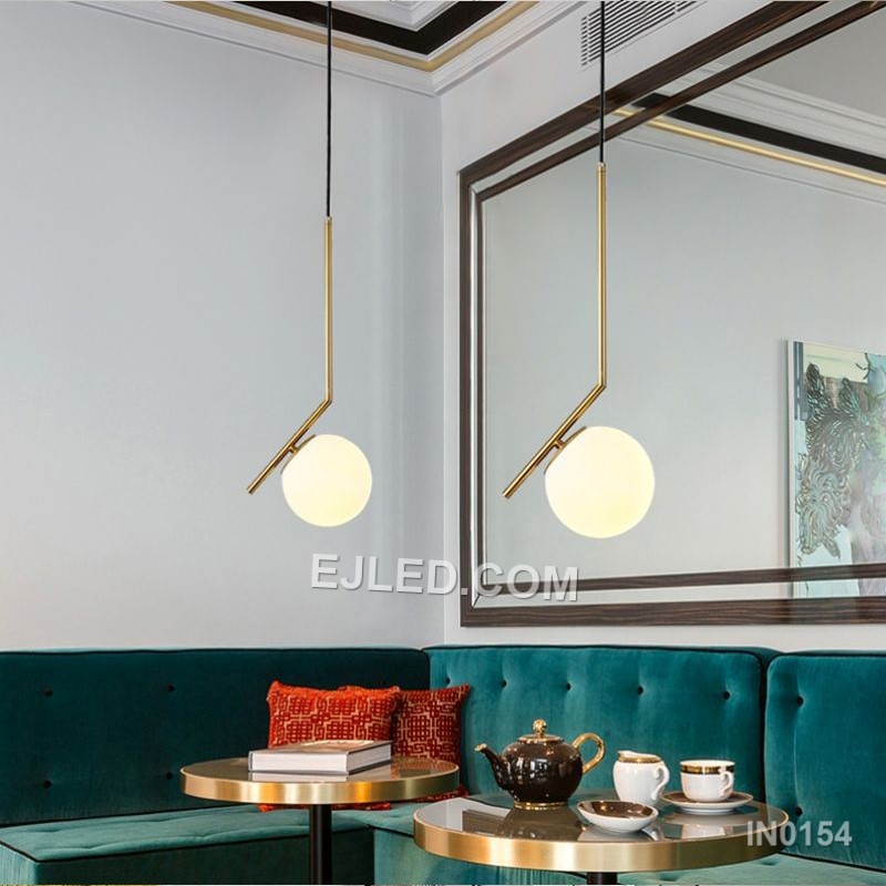 Brass and glass combine in the IN0154, a single pendant light with an open-bottom round glass shade encased by a polished brass frame. This design offers a broad, unobstructed downward light while its open frame minimises glare from the bulb. - view 4