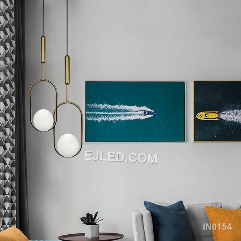 Brass and glass combine in the IN0154, a single pendant light with an open-bottom round glass shade encased by a polished brass frame. This design offers a broad, unobstructed downward light while its open frame minimises glare from the bulb. - view 5
