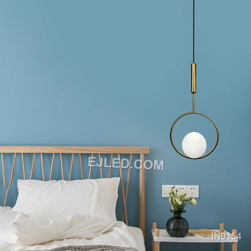 Brass and glass combine in the IN0154, a single pendant light with an open-bottom round glass shade encased by a polished brass frame. This design offers a broad, unobstructed downward light while its open frame minimises glare from the bulb. - view 7