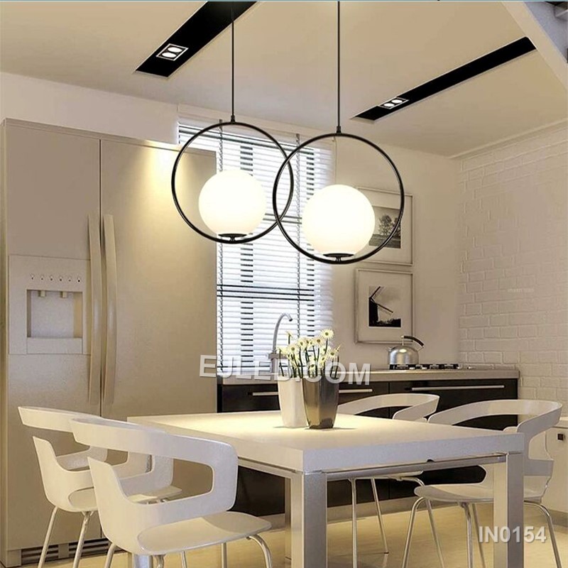 Brass and glass combine in the IN0154, a single pendant light with an open-bottom round glass shade encased by a polished brass frame. This design offers a broad, unobstructed downward light while its open frame minimises glare from the bulb. - view 8