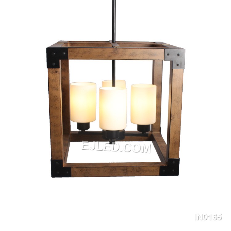 The IN0165 is a linear pendant light featuring a black iron open cage frame with a wood-finish accent bar. Three frosted, candle-shaped glass shades house the E27 bulbs, providing soft, diffused light.