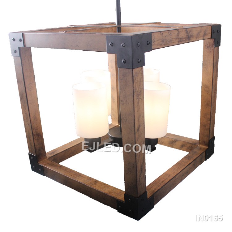 The IN0165 is a linear pendant light featuring a black iron open cage frame with a wood-finish accent bar. Three frosted, candle-shaped glass shades house the E27 bulbs, providing soft, diffused light. - view 4