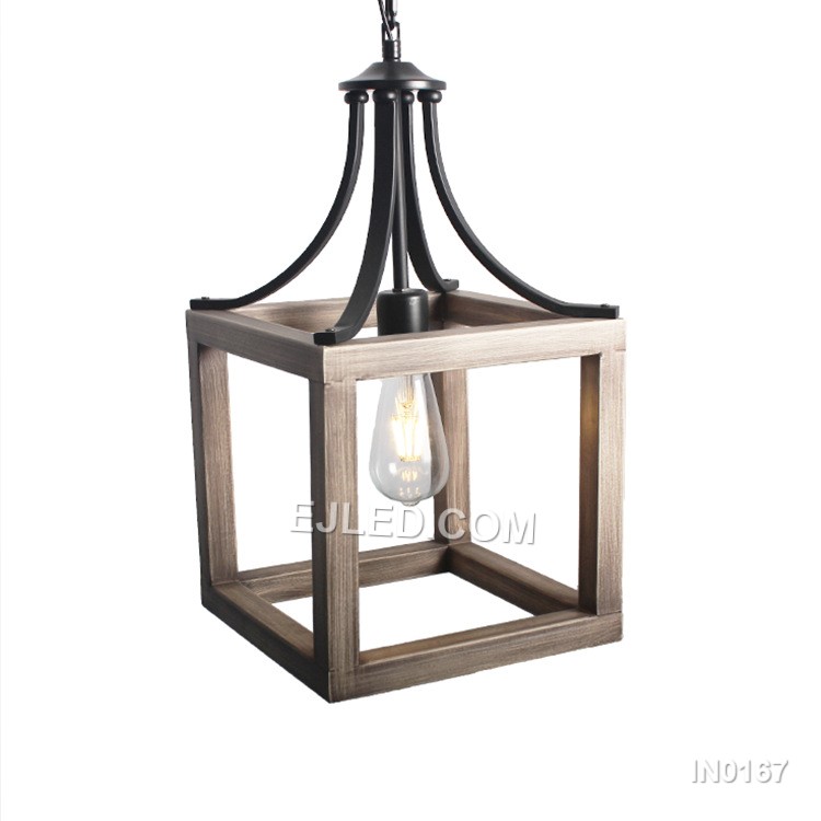 The IN0167 iron pendant light offers a distinctive open cage design. Its black metal frame features a subtle wood grain finish on the inner surfaces of the angled panels, creating a warm, industrial-inspired aesthetic. This single-lamp fixture provides direct, ambient light.