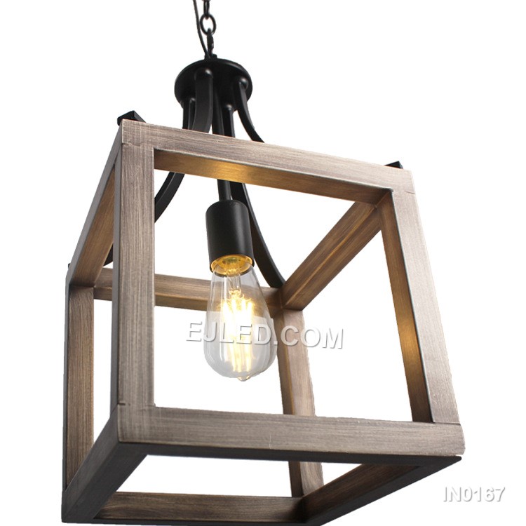 The IN0167 iron pendant light offers a distinctive open cage design. Its black metal frame features a subtle wood grain finish on the inner surfaces of the angled panels, creating a warm, industrial-inspired aesthetic. This single-lamp fixture provides direct, ambient light. - view 2