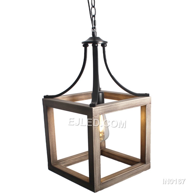 The IN0167 iron pendant light offers a distinctive open cage design. Its black metal frame features a subtle wood grain finish on the inner surfaces of the angled panels, creating a warm, industrial-inspired aesthetic. This single-lamp fixture provides direct, ambient light. - view 3