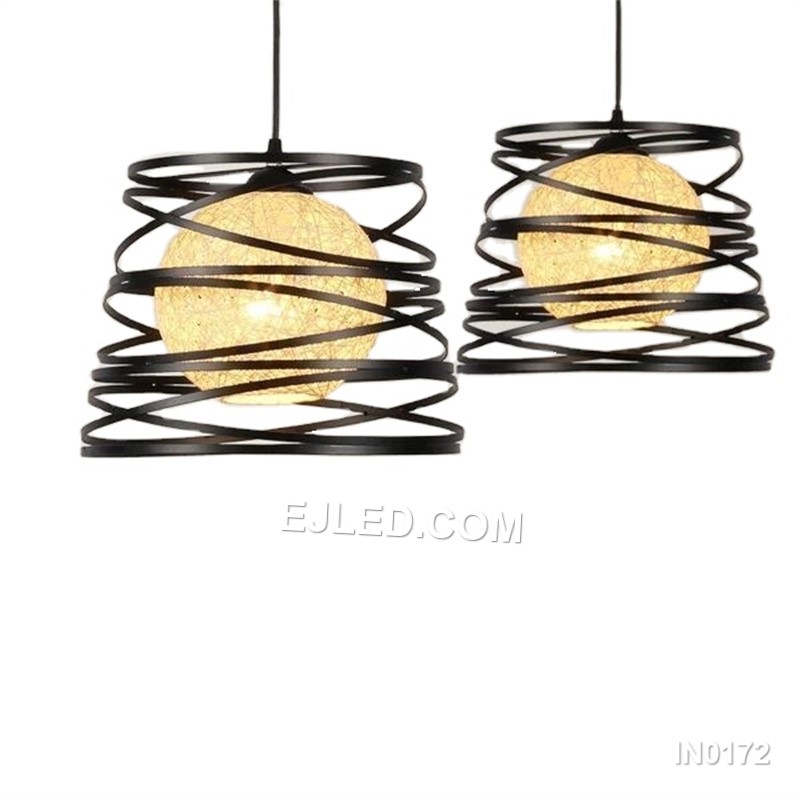 The IN0172 is a substantial globe pendant, combining a decorative black iron outer cage with a light fabric inner shade. Its generous proportions make it suitable for rooms with higher ceilings or as a focal point over a dining table.