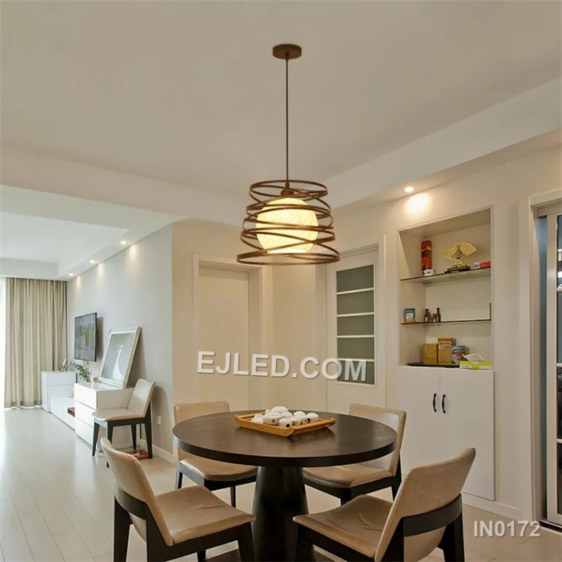 The IN0172 is a substantial globe pendant, combining a decorative black iron outer cage with a light fabric inner shade. Its generous proportions make it suitable for rooms with higher ceilings or as a focal point over a dining table. - view 3
