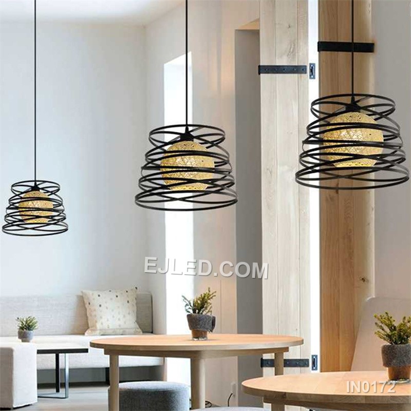 The IN0172 is a substantial globe pendant, combining a decorative black iron outer cage with a light fabric inner shade. Its generous proportions make it suitable for rooms with higher ceilings or as a focal point over a dining table. - view 4