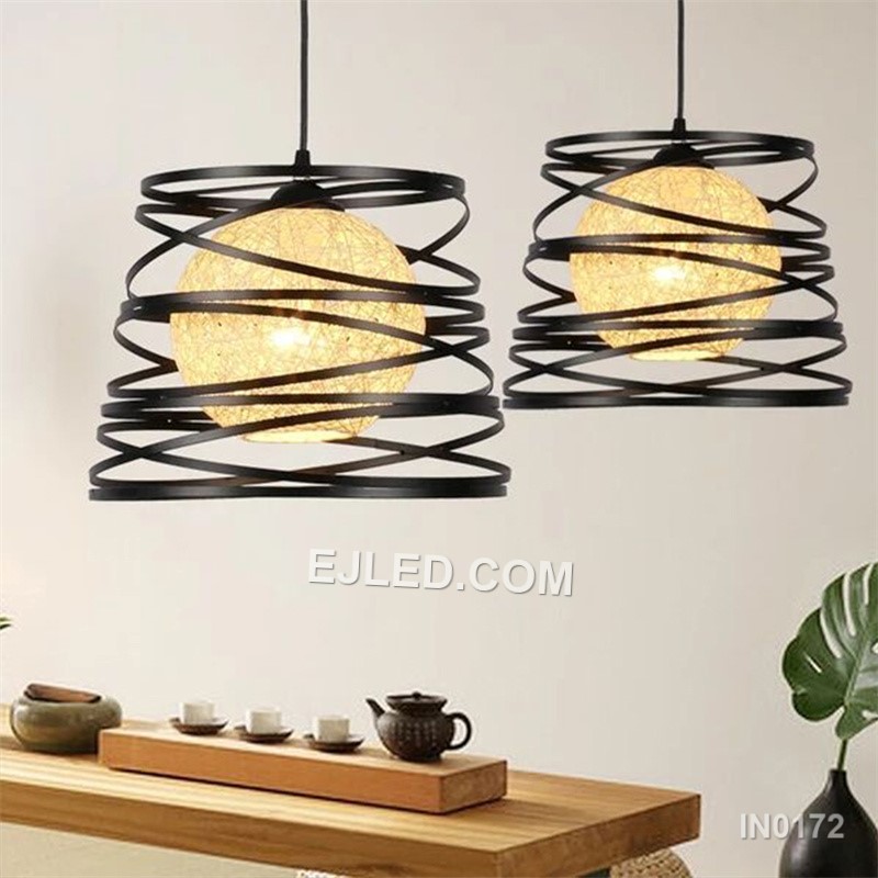 The IN0172 is a substantial globe pendant, combining a decorative black iron outer cage with a light fabric inner shade. Its generous proportions make it suitable for rooms with higher ceilings or as a focal point over a dining table. - view 5