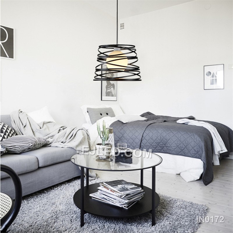 The IN0172 is a substantial globe pendant, combining a decorative black iron outer cage with a light fabric inner shade. Its generous proportions make it suitable for rooms with higher ceilings or as a focal point over a dining table. - view 6