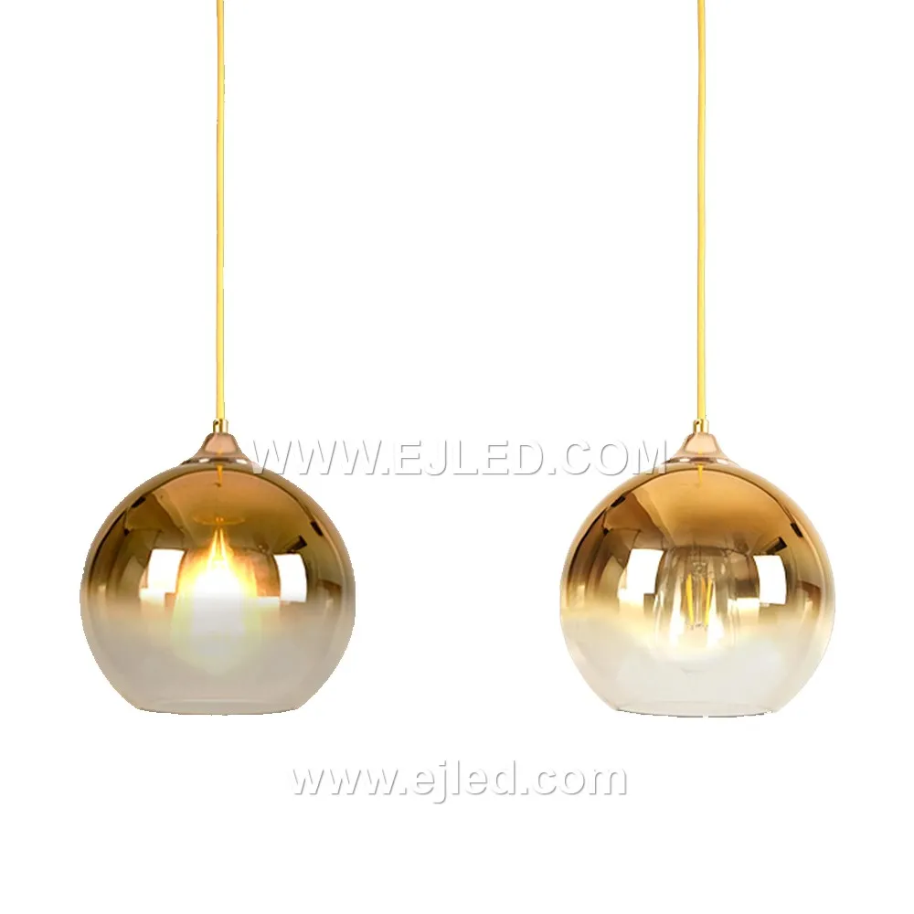 Model GL0002 is a single-lamp pendant featuring a large, clear spherical glass shade of 20cm diameter, suitable for creating a bright, open feel. Its golden-brushed brass finish suspension provides a refined contrast to the transparent globe. - view 5
